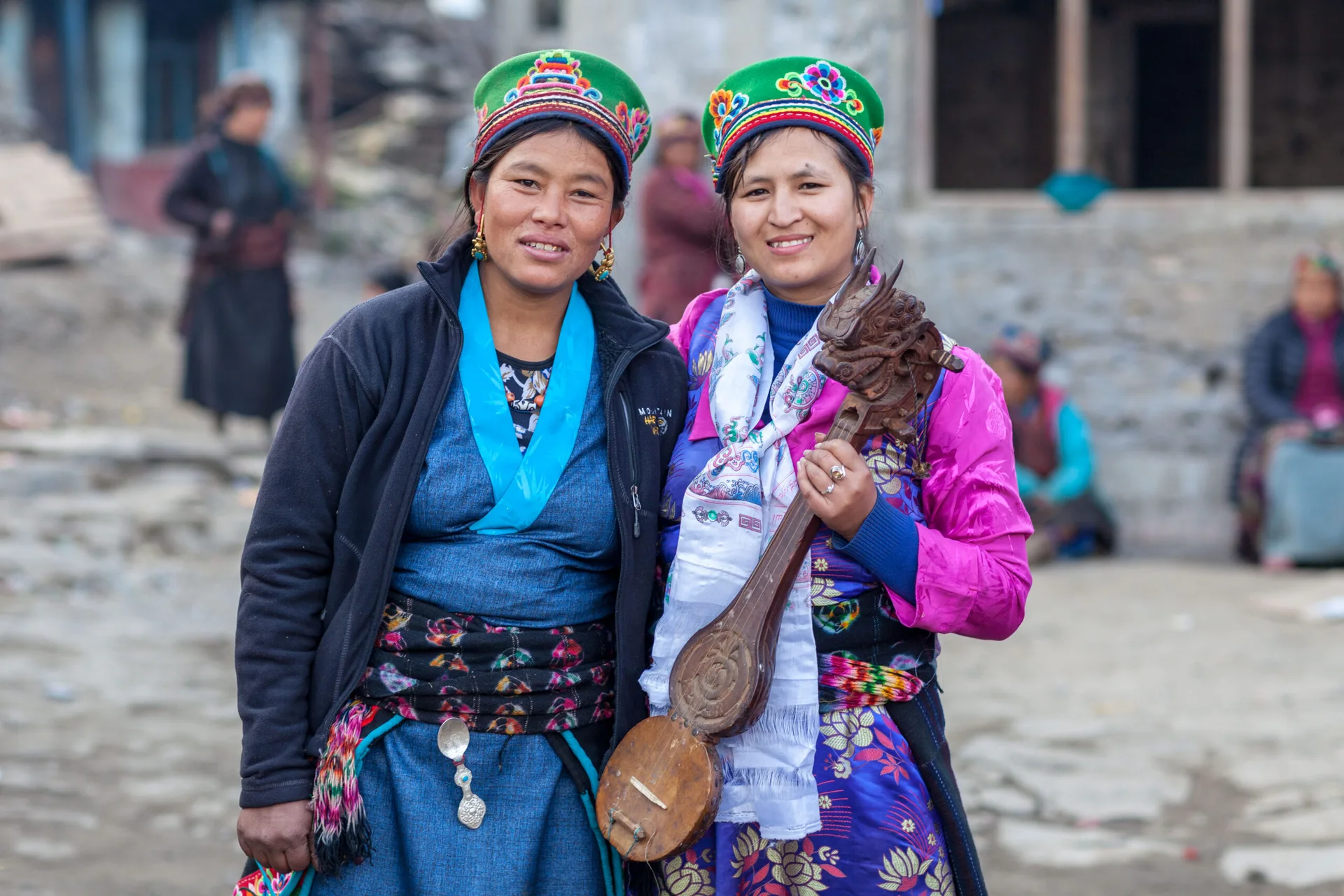 Local women sharing a warm welcome in traditional Nepali dress